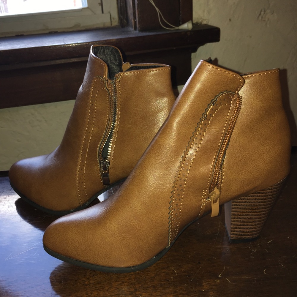 Brown ankle booties, zippers on both sides.